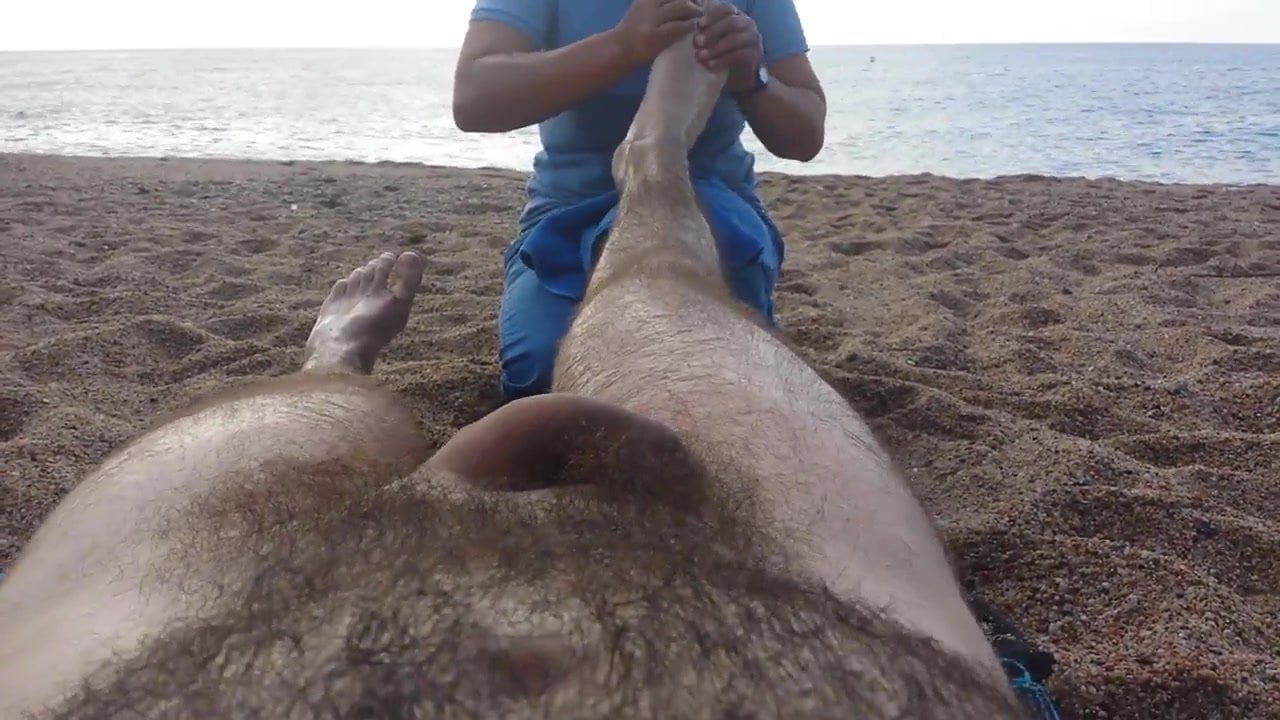 Nude massage on the beach